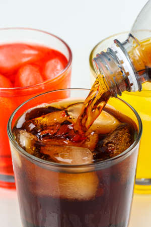 Pouring cola drink drinks lemonade soft drinks in a glass portrait format pourの写真素材