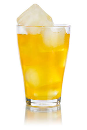 Orange lemonade drink soft drink in a glass isolated on a white backgroundの写真素材