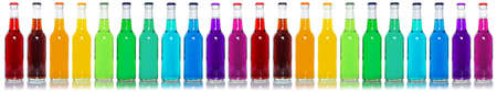 Drinks lemonade cola drink many soft drinks bottles in a row bottle isolated on whiteの写真素材