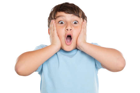 Child kid amazed surprised astonished surprise happiness joy little boy isolated on a white backgroundの写真素材