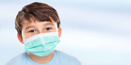Child kid little boy wearing face mask against virus  portrait with copy space bannerの写真素材