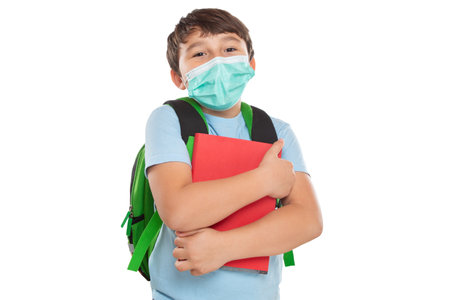 Young student child kid little boy wearing face mask against Virus  isolated on a white backgroundの写真素材
