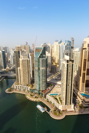 Dubai Marina and Harbor skyline architecture overview wealth luxury travel in United Arab Emirates portrait format modernの写真素材
