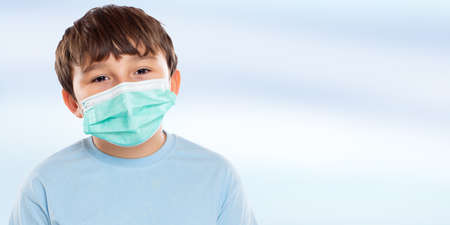 Child kid little boy wearing face mask against  Virus portrait with copy space bannerの写真素材