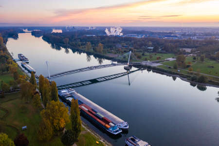 Bridge of the two riverbanks over Rhine river between Kehl and Strasbourg Germany France aerial photo viewの写真素材