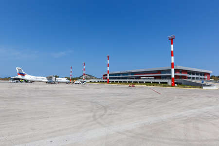 Zakynthos, Greece - September 21, 2020: Sky Express ATR 72-500 airplane and Terminal of Zakynthos airport (ZTH) in Greece.のeditorial素材