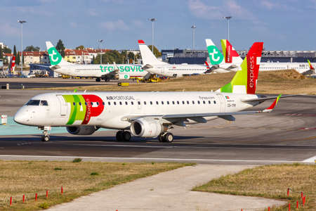 Lisbon, Portugal - September 22, 2021: TAP Portugal Express Embraer 190 airplane at Lisbon airport (LIS) in Portugal.のeditorial素材