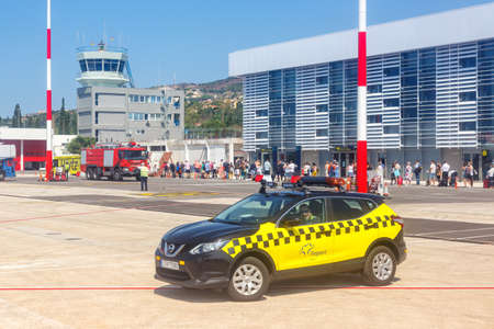 Kefalonia, Greece - September 20, 2020: Terminal of Kefalonia airport (EFL) and Follow me car in Greece.のeditorial素材
