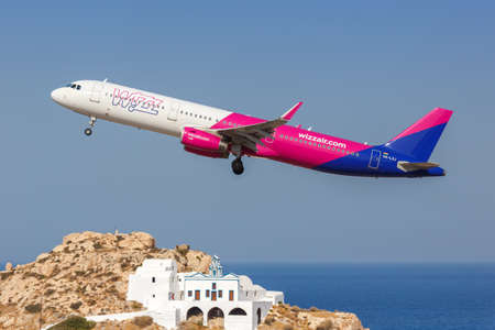Santorini, Greece - August 4, 2021: Wizzair Airbus A321 airplane at Santorini airport (JTR) in Greece.のeditorial素材