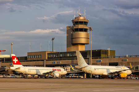 Zurich, Switzerland - July 22, 2020: Vueling and Swiss Airbus A320 airplanes at Zurich airport (ZRH) in Switzerland.のeditorial素材