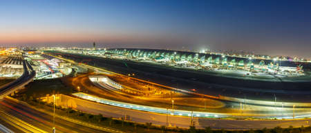 Dubai, United Arab Emirates - May 27, 2021: Overview International Airport Terminal DXB panorama at night at Dubai airport (DXB) in the United Arab Emirates.のeditorial素材