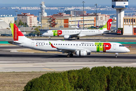 Lisbon, Portugal - September 24, 2021: TAP Portugal Express Embraer 195 airplane at Lisbon airport (LIS) in Portugal.のeditorial素材