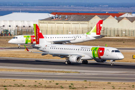 Lisbon, Portugal - September 24, 2021: TAP Portugal Express Embraer 190 airplane at Lisbon airport (LIS) in Portugal.のeditorial素材
