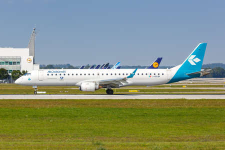 Munich, Germany - September 9, 2021: Air Dolomiti Embraer 195 airplane at Munich airport (MUC) in Germany.のeditorial素材