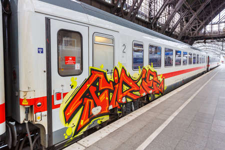 Cologne, Germany - August 3, 2021: Graffiti on a train of Deutsche Bahn DB at Cologne main railway station in Germany.のeditorial素材