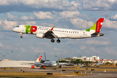 Lisbon, Portugal - September 22, 2021: TAP Portugal Express Embraer 190 airplane at Lisbon airport (LIS) in Portugal.のeditorial素材