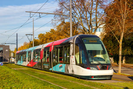 Strasbourg, France - October 29, 2021: Modern light rail tram model Alstom Citadis public transport transit transportation traffic in Strasbourg, France.のeditorial素材