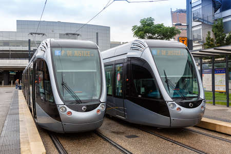Toulouse, France - September 21, 2021: Modern light rail trams model Alstom Citadis public transport transit at Blagnac airport in Toulouse, France.のeditorial素材
