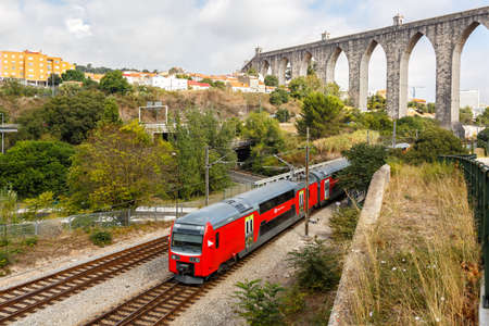 Lisbon, Portugal - September 24, 2021: Train rail railway at aqueduct Aqueduto das Aguas Livres in Lisbon Lisboa, Portugal.のeditorial素材
