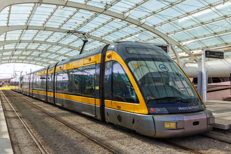 Porto, Portugal - September 22, 2021: Modern light rail Metro do Porto tram public transport transit transportation traffic at airport station in Porto, Portugal.のeditorial素材