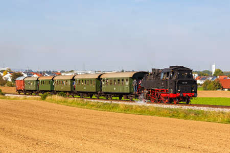 Korntal, Germany - October 10, 2021: Steam train locomotice railway engine of StrohgÃ¤ubahn in Korntal, Germany.のeditorial素材