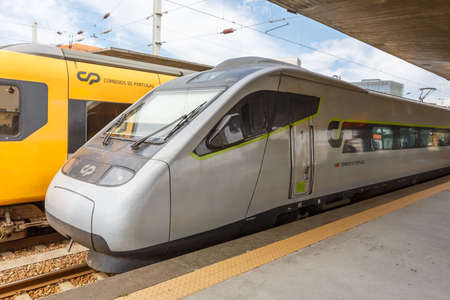 Porto, Portugal - September 23, 2021: Alfa Pendular high-speed train at Porto Campanha railway station public transport transit in Portugal.のeditorial素材