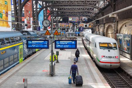 Hamburg, Germany - April 21, 2021: Main railway station Hauptbahnhof Hbf Deutsche Bahn DB with trains in Hamburg, Germany.のeditorial素材