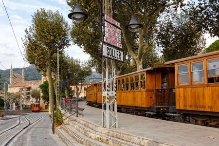 Soller, Spain - October 21, 2021: Ancient train Tren de Soller public transport transit transportation at Soller railway station on Mallorca in Spain.のeditorial素材