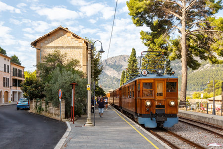 Bunyola, Spain - October 21, 2021: Ancient train Tren de Soller public transport transit transportation at Bunyola railway station on Mallorca in Spain.のeditorial素材