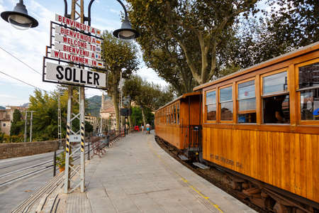 Soller, Spain - October 21, 2021: Ancient train Tren de Soller public transport transit transportation at Soller railway station on Mallorca in Spain.のeditorial素材