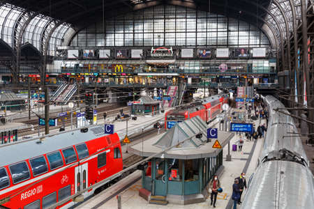 Hamburg, Germany - April 21, 2021: Main railway station Hauptbahnhof Hbf Deutsche Bahn DB with trains in Hamburg, Germany.のeditorial素材