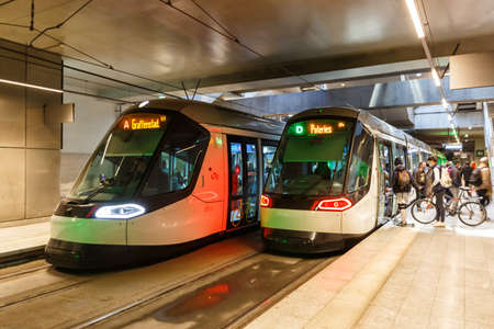 Strasbourg, France - October 29, 2021: Modern light rail trams model Alstom Citadis public transport transit transportation underground station Gare Centrale in Strasbourg, France.のeditorial素材