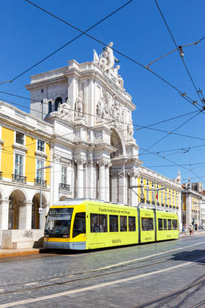 Lisbon, Portugal - September 23, 2021: Lisbon Tram light rail public transport transit transportation traffic at the triumphal arch in Portugal.のeditorial素材