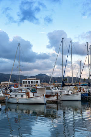 Port de Pollenca marina with sailing boats sailboats on Mallorca travel traveling holidays vacation portrait format in boat Spainのeditorial素材