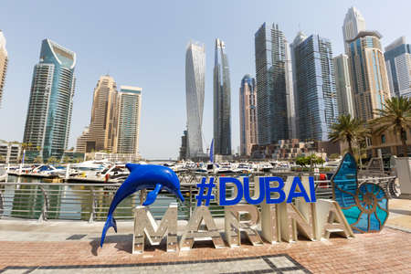 Dubai Marina logo and Harbor skyline architecture wealth luxury travel in United Arab Emirates modernのeditorial素材