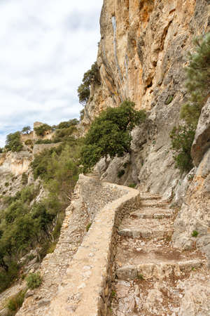 Stairs stairway to castle Castell d'Alaro hiking trail path way on Mallorca travel traveling holidays vacation portrait format tourism in Spainのeditorial素材
