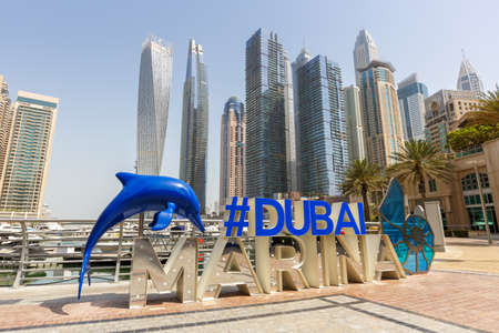 Dubai Marina logo and Harbor skyline architecture wealth luxury travel in United Arab Emirates modernのeditorial素材