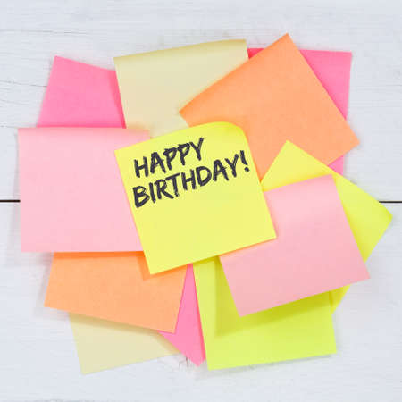 Happy Birthday greetings celebration business concept desk note paper square notepaperの写真素材