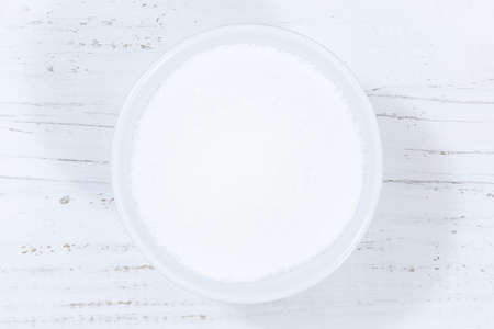 Sugar from above bowl wooden board woodの写真素材