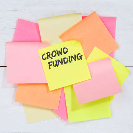 Crowd funding crowdfunding collecting money online investment internet business concept desk note paper notepaperの写真素材