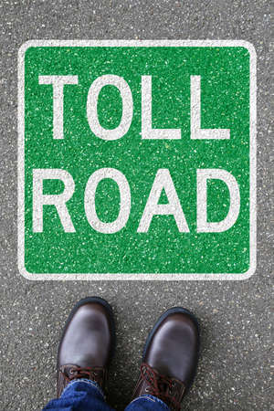 Man people toll road street city town pay paying portrait format clean air highway sign zone transportationの写真素材