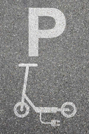 Parking lot sign electric scooter e-scooter road portrait format eco friendly mobility city transport transportationの写真素材