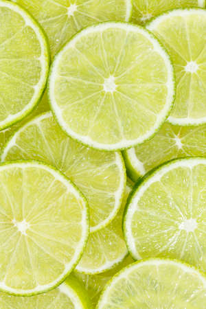 Limes citrus fruits lime collection food background portrait format fresh fruit backgroundsの写真素材