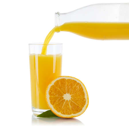 Orange fruit juice pouring orange glass square isolated on a white backgroundの写真素材