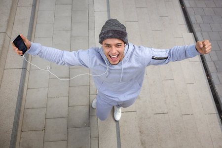Success successful happy smiling young latin man fitness sport sports joy pleasure outdoorの写真素材