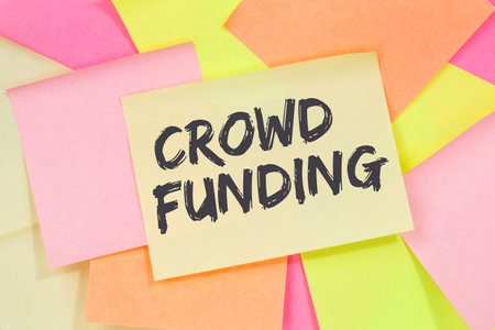 Crowd funding crowdfunding collecting money online investment internet business concept note paper notepaperの写真素材