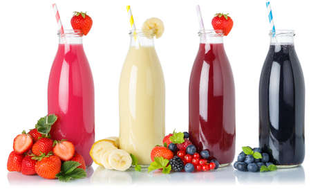 Collection of fruit smoothies fruits juice drink straw wild berries in a bottle isolated on a white backgroundの写真素材