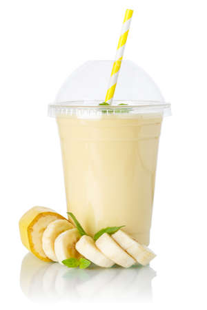 Banana smoothie fruit juice drink milkshake milk shake in a cup isolated on a white backgroundの写真素材