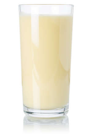Banana smoothie fruit juice drink milkshake milk shake in a glass isolated on a white backgroundの写真素材