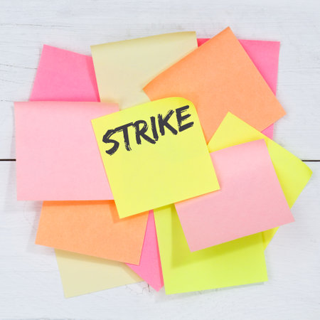Strike protest action demonstrate jobs, job employees business concept desk note paper notepaperの写真素材